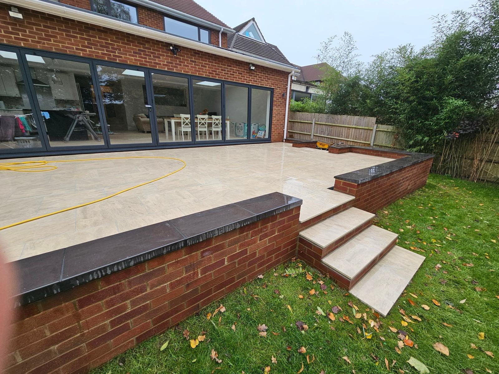 Completed rear house extension and tiled terrace by Fortis Developments